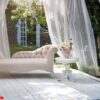 summer garden gazebo with curtains and sofa for relaxation.