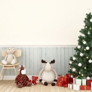 animal doll with christmas tree and gift box in living room a