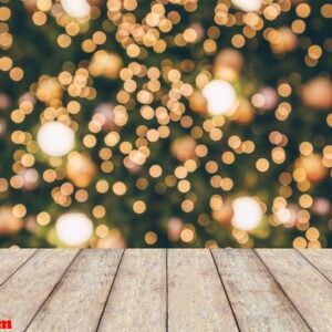 wood table top with abstract christmas holiday festive bokeh lig