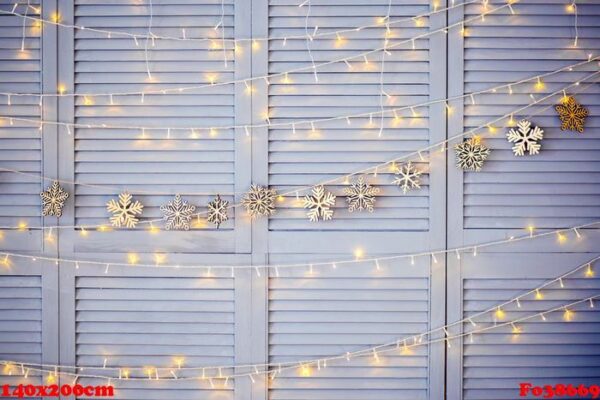 christmas decoration on the wall. wooden christmas garland and lanterns.