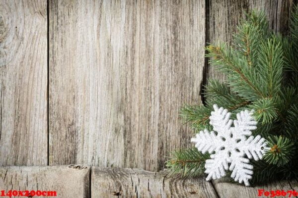 christmas decoration with fir branches on the wood background.