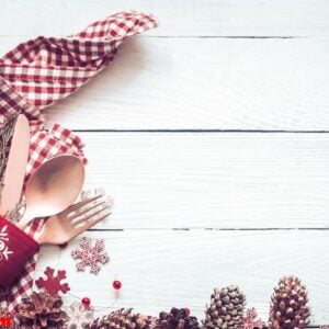 christmas dinner cutlery on a white wooden background