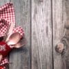 christmas dinner cutlery with decor on a wooden background