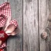 christmas dinner cutlery with decor on a wooden background