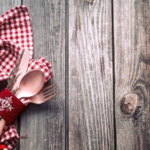 christmas dinner cutlery with decor on a wooden background