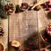 christmas mulled wine with spices on a wooden rustic table.