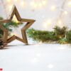 christmas star, fir branches, new year decorations, notepad on a light background