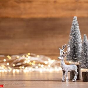 colorful christmas tree on wooden, bokeh background.