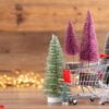 colorful christmas tree on wooden, bokeh background.