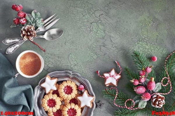 flat lay with xmas decorations in green and red with frosted ber