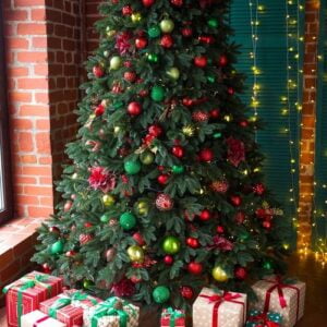 green christmas tree decorated with christmas gifts and a garland. new year.