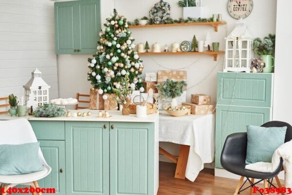 interior light kitchen with christmas decor and tree. turquoise colored kitchen in classic style. christmas in the kitchen. bright kitchen in mint and white shades with christmas.