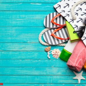 beach accessories on wooden table.