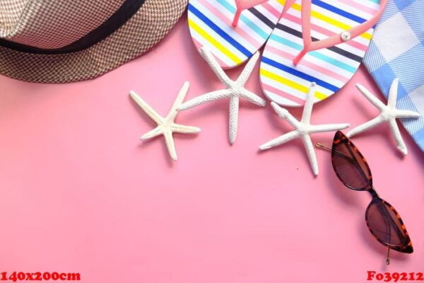 flat composition of summer beach accessories on pink background .