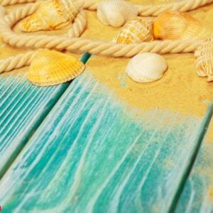 sea sand and sea shells on blue wooden floor