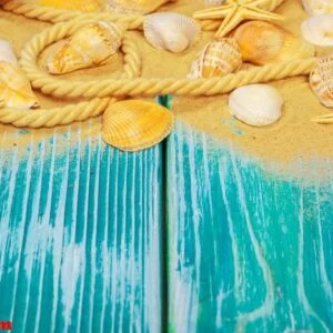 sea sand and sea shells on blue wooden floor