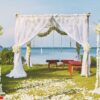 beautiful beach wedding flower arch setting for wedding venue with panoramic ocean view