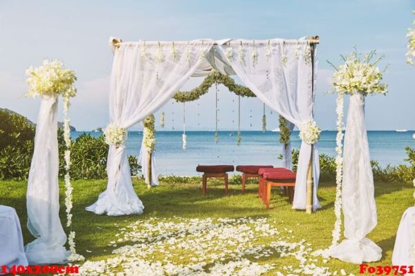 beautiful beach wedding flower arch setting for wedding venue with panoramic ocean view