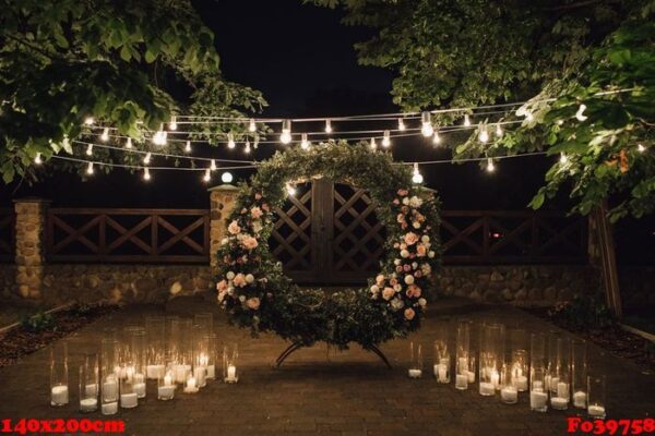 beautiful photozone with big wreath decorated with greenery and