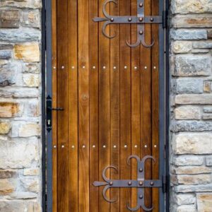 close up of old wooden door with metal decoration