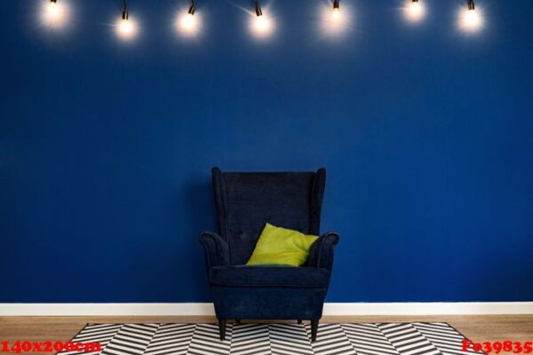 dark blue arm chair against blue wall in modern living room