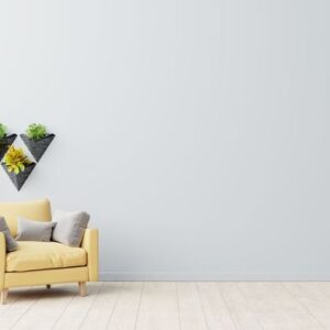 the interior has a yellow armchair on empty gray wall background.