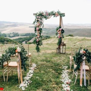 italian wedding decoration. green eucalyptus, oranges and pink f