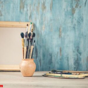 paint brushes on the desk on abstract background