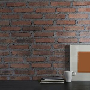 photo of black working desk along with book, notebook, picture f