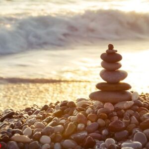 pyramid of sea stones on the beach