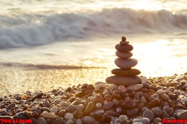 pyramid of sea stones on the beach