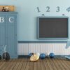 retro child playroom with blue cabinet, blackboard and toys 3d rendering