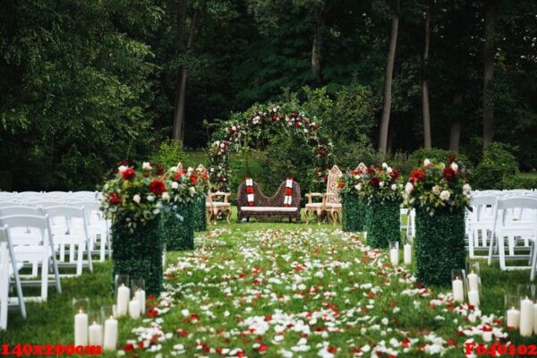 rose petals cover green garden ready for traditional hindu weddi