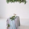 wedding. banquet. the chairs and table for guests, decorated with candles, served with cutlery and crockery and covered with a tablecloth.