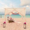 wedding arch on beach with tropical maldives resort and sea