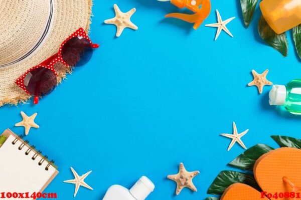 beach accessories with straw hat, sunscreen bottle and seastar on blue background top view with copy space