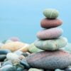 stack of stones on the beach and sea background