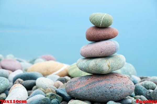 stack of stones on the beach and sea background