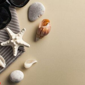 tropical background. flatlay with starfish, sunglasses on a colored background. the concept of travel, sea. copy space