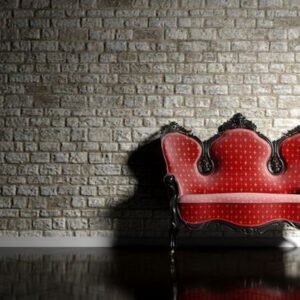 antique sofa on brick wall background