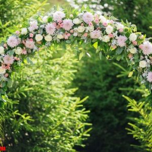 arch at a wedding ceremony made of flowers