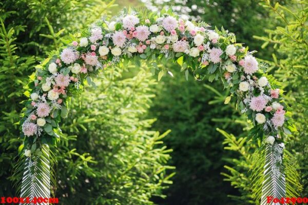 arch at a wedding ceremony made of flowers