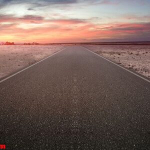 asphalt road with tree and drought land