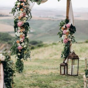 beautiful archway decorated with floral composition outdoors