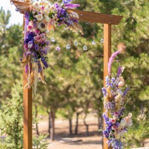 a beautiful venue for an open air wedding ceremony. wedding arch and rows of guest chairs on a green lawn overlooking the river