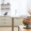 bouquet of flowers on the background of the interior of a modern kitchen in a scandinavian style.