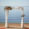 flower arch on the lake shore. background for wedding invitations.