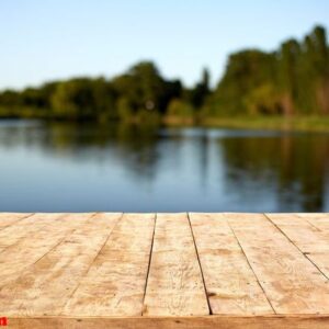 mockup. empty wooden deck table with foliage bokeh background.