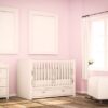 mockup of two blank frames on baby room pink wall