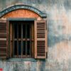 old cement wall with wood window background.